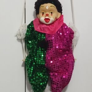 Sparkling Green and Pink Antique Clown on Swing.